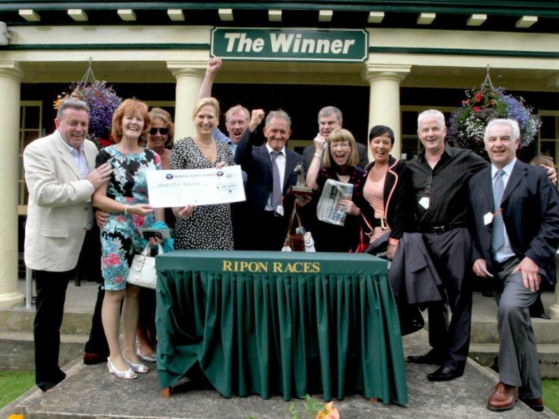 Photo of our syndicate members celebrating Grey Street's win at Ripon.